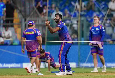 Mumbai Indians' Jasprit Bumrah and others before an Indian Premier League (IPL) 2026 T20 cricket match between Mumbai Indians and Kolkata Knight Riders, at the Wankhede Stadium, in Mumbai, Maharashtra.