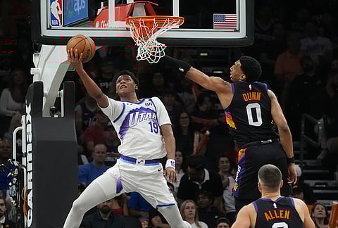 Utah Jazz guard Ace Bailey (19) goes up for a shot against Phoenix Suns forward Ryan Dunn (0) during the first half of an NBA basketball game, in Phoenix.