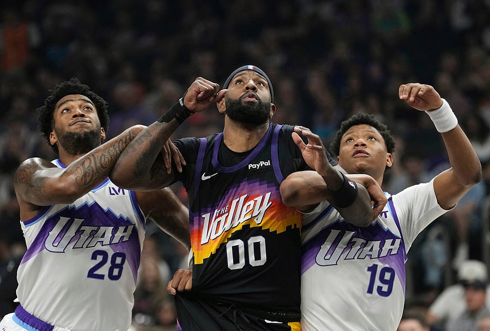 Utah Jazz forward Brice Sensabaugh (28), Phoenix Suns forward Royce O'Neale (00) and Jazz guard Ace Bailey (19) battle for position for a rebound during the first half of an NBA basketball game in Phoenix.  - | Photo: AP/Ross D. Franklin