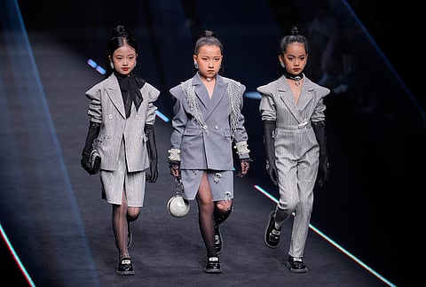 Young models wear a creation by V&V by YaoYao during China Fashion Week (Spring) 2026 in Beijing, China.