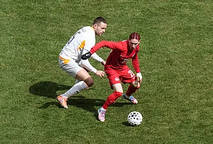 | Photo: Chris Young/The Canadian Press via AP : Canada's Marcelo Flores turns away from Iceland's Sverrir Ingi Ingason during the second half of an international friendly soccer match in Toronto.