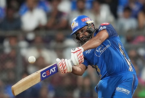 Mumbai Indians' Rohit Sharma plays a shot during the Indian Premier League cricket match between Mumbai Indians and Kolkata Knight Riders in Mumbai.