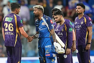| Photo: AP/Rafiq Maqbool : Mumbai Indians' captain Hardik Pandya, second left, shake hands with Kolkata Knight Riders' Kartik Tyagi after won the match during the Indian Premier League cricket match between Mumbai Indians and Kolkata Knight Riders in Mumbai.