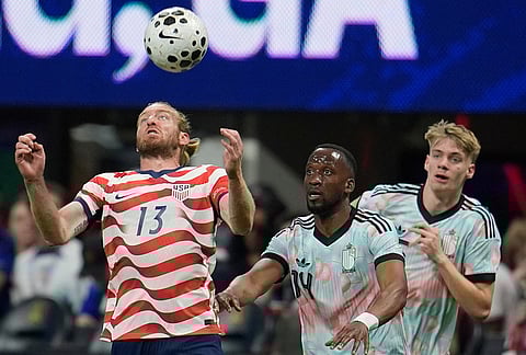 United States' Tim Ream (13) tries the control the ball as Belgium's Dodi Lukebakio (14) looks on during the second half of an international friendly soccer match, in Atlanta. 