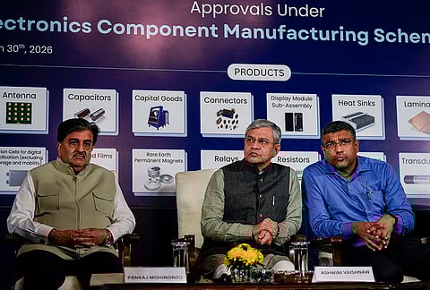 Union Minister Ashwini Vaishnaw, centre, Founder and National President of Indian Cellular Association Pankaj Mohindroo, left, and Secretary for the Ministry of Electronics and Information Technology (MeitY) S Krishnan during an event on the Electronics Component Manufacturing Scheme at National Media Centre, in New Delhi.