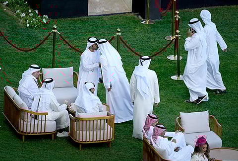 Racegoers gather at the Meydan Racecourse ahead of Dubai World Cup in Dubai, United Arab Emirates.