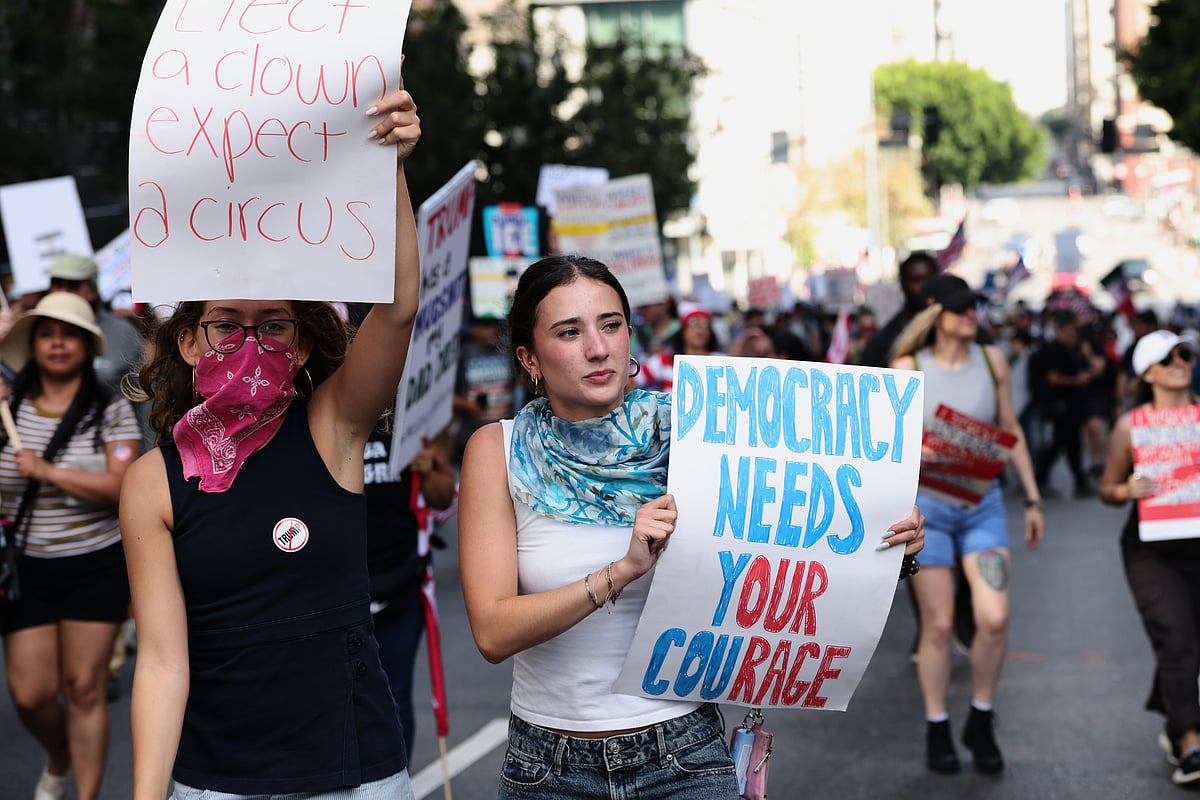 Demonstrators march through downtown Los Angeles during a "No Kings" protest Saturday, March 28, 2026. (AP Photo/Jill Connelly) - Source: AP
