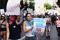 Hope Rising Amid Global Crisis And Resistance Source: AP
: Demonstrators march through downtown Los Angeles during a "No Kings" protest Saturday, March 28, 2026. (AP Photo/Jill Connelly)