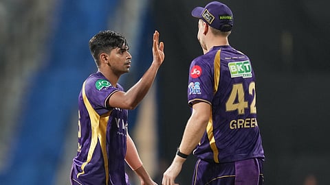 Kolkata Knight Riders' Kartik Tyagi, left, and Cameron Green celebrate the wicket of Mumbai Indians' Suryakumar Yadav during the Indian Premier League cricket match between Mumbai Indians and Kolkata Knight Riders in Mumbai, India, Sunday, March 29, 2026.