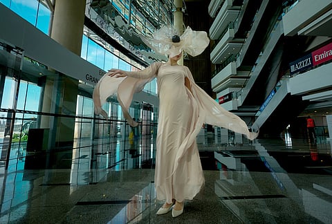 An artist performs at the grandstand ahead of Dubai World Cup at the Meydan racecourse in Dubai, United Arab Emirates.
