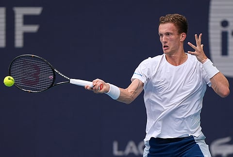 Jiri Lehecka of Czech Republic returns a ball against Jannik Sinner of Italy in the men's singles final at the Miami Open tennis tournament, in Miami Gardens, Florida.