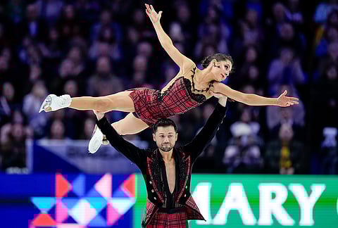Lilah Fear and Lewis Gibson from Great Britain compete during the ice dance free dance at the Figure Skating World Championships in Prague, Czech Republic.