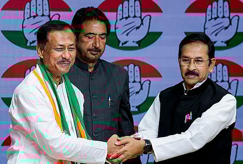 TMC MLA Kazi Abdul Rahim, left, is greeted by West Bengal Pradesh Congress Committee President Subhankar Sarkar as he joins the Congress party at the party headquarters, in New Delhi. AICC General Secretary Ghulam Ahmad Mir is also seen. 