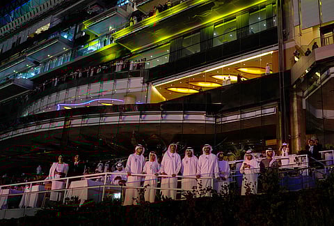 Emirati men watch Dubai World Cup horse races closing ceremony at Meydan Racecourse in Dubai, United Arab Emirates.