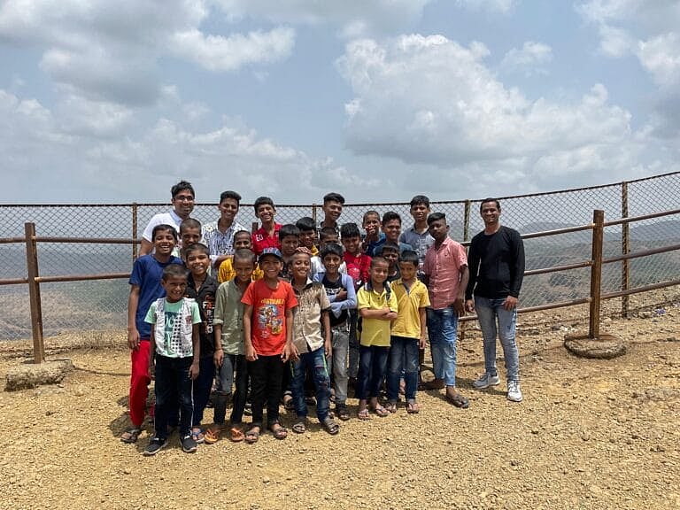 Group of children posing for CSR Initiative of Naviora Journeys