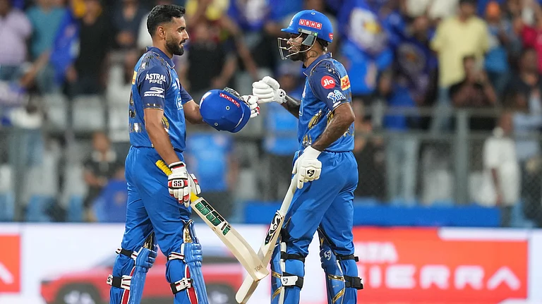 Mumbai Indians' captain Hardik Pandya, right, and Naman Dhir celebrate after won the match during the Indian Premier League cricket match between Mumbai Indians and Kolkata Knight Riders in Mumbai, India, Sunday, March 29, 2026. - | Photo: AP/Rafiq Maqbool