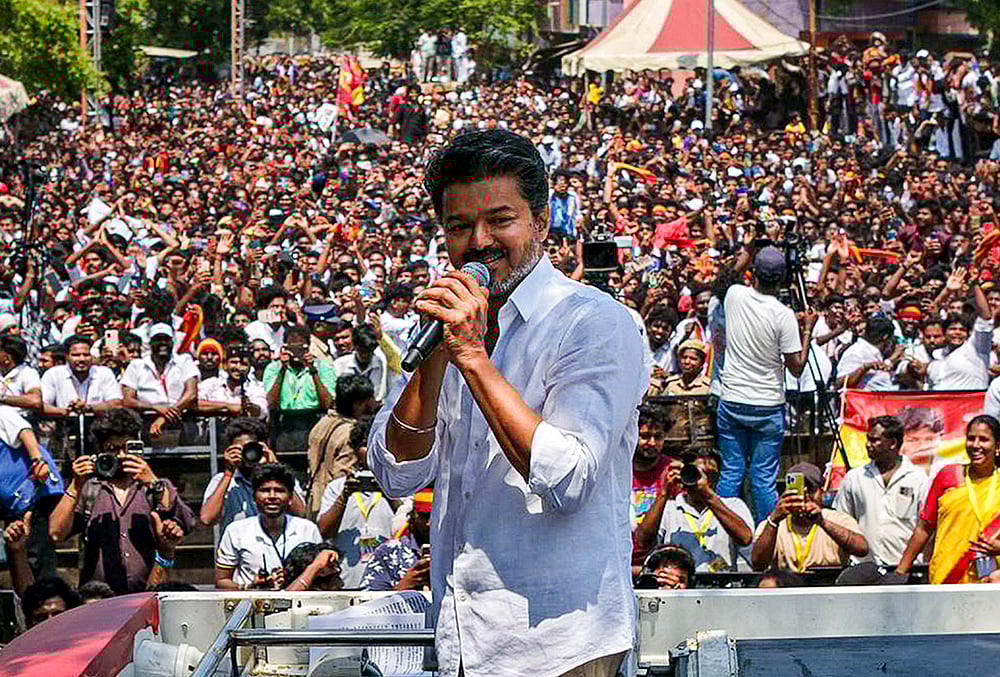 Tamilaga Vettri Kazhagam (TVK) chief and actor Vijay campaigns after filing his nomination papers for the Tamil Nadu Assembly elections from the Perambur constituency, in Chennai.  - | Photo: Handout via PTI 