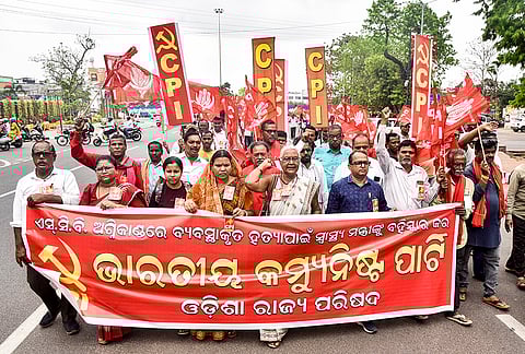 CPI activists along with other opposition members take out a joint demonstration over the SCB Medical College and Hospital ICU fire incident, demanding the resignation of the state Health & Family Welfare Minister Mukesh Mahaling, in Bhubaneswar. 