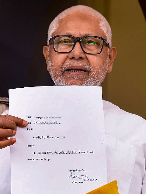JD(U) MLC Sanjay Gandhi displays the resignation letter of Bihar Chief Minister Nitish Kumar from the Legislative Council, at the Bihar Vidhan Sabha, in Patna.