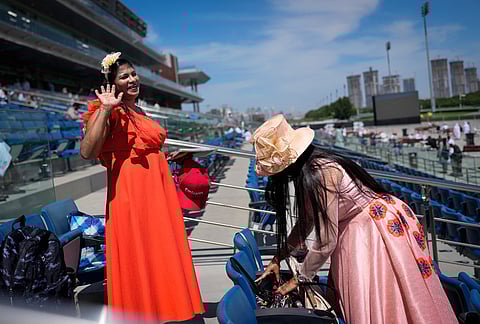 Racegoers arrive ahead of the Dubai World Cup at Meydan Racecourse in Dubai, United Arab Emirates.