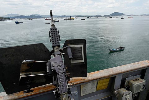 The Panamanian military patrols the U.S. Navy warship USS Gridley in Panama City.