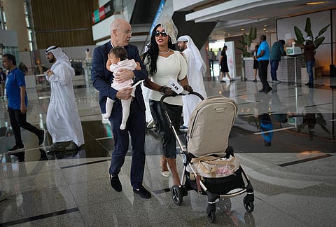 Racegoers arrive at the grandstand ahead of the Dubai World Cup at Meydan Racecourse in Dubai, United Arab Emirates.