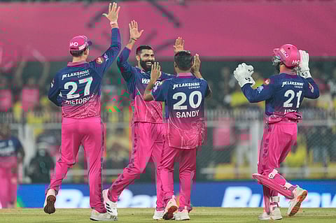 Rajasthan Royals' Ravindra Jadeja, second left, celebrates with teammates the wicket of Chennai Super Kings' Shivam Dube during the Indian Premier League cricket match between Chennai Super Kings and Rajasthan Royals in Guwahati, India, Monday, March 30, 2026