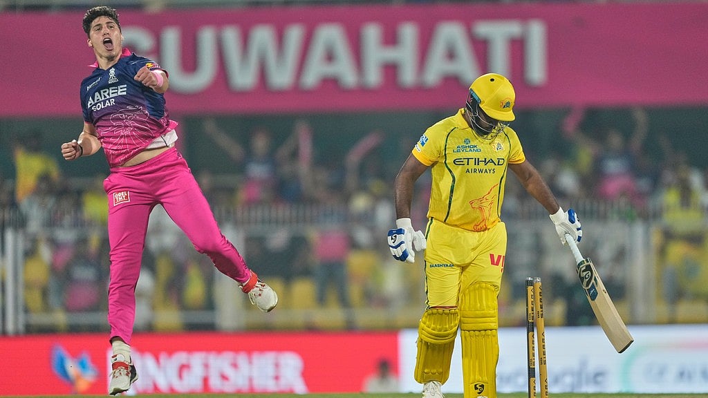 Rajasthan Royals' Nandre Burger, left, celebrates the wicket of Chennai Super Kings' Sanju Samson during their Indian Premier League match in Guwahati. - AP