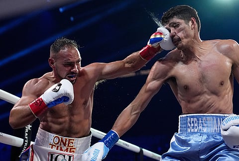 Keith Thurman lands a left to Sebastian Fundora in a super welterweight championship boxing match in Las Vegas. 