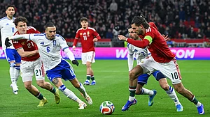 Tamas Purger/MTI via AP : Dominik Szoboszlai, right, of Hungary and Giorgos Masouras, second right, of Greece fight for the ball during the soccer friendly match.