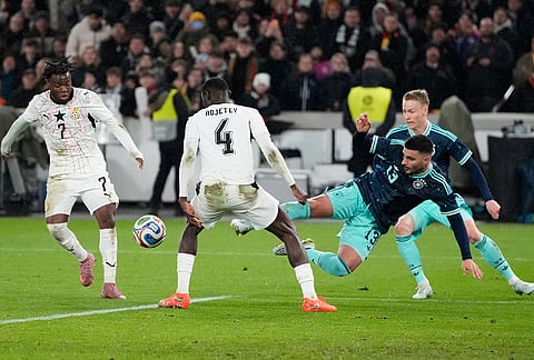 Deniz Undav of Germany and Jonas Adjetey of Ghana challenge for the ball during an international friendly soccer match between Germany and Ghana in Stuttgart, Germany.