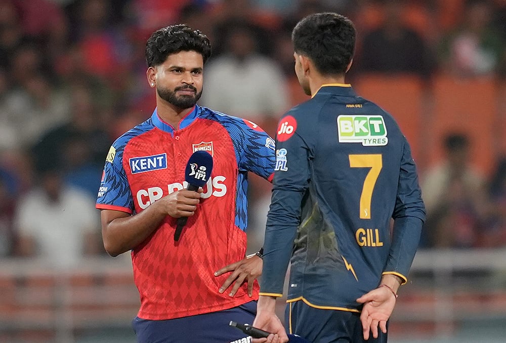 Punjab Kings' captain Shreyas Iyer, left, and Gujarat Titans' Shubman Gill during the toss before an Indian Premier League (IPL) 2026 T20 cricket match between Punjab Kings and Gujarat Titans, in Mullanpur. - | Photo: PTI/Shiva Sharma