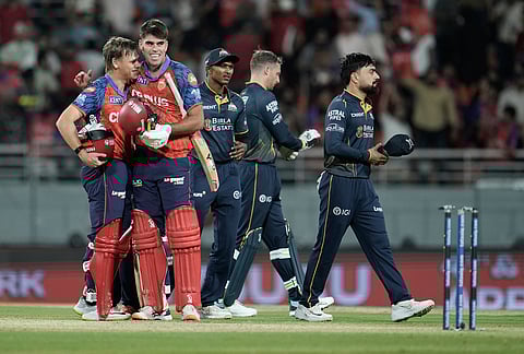 Punjab Kings' Cooper Connolly, left, and Xavier Bartlett celebrate after winning the Indian Premier League cricket match against Gujarat Titans in New Chandigarh.