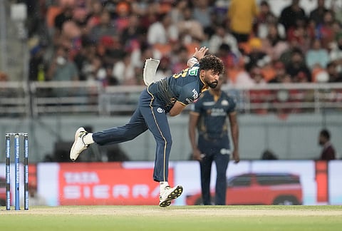 Gujarat Titans' Mohammed Siraj bowls a delivery during the Indian Premier League cricket match between Gujarat Titans and Punjab Kings in New Chandigarh.