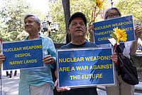 US-Israel War On Iran: Nations Being Compelled To Rethink Nuclear Option Members of New York Campaign To Abolish Nuclear Weapons (NYCAN) hold sunflowers and signs that read NUCLEAR WEAPONS ARE A WAR AGAINST THE FUTURE NUCLEAR WEAPONS DESPOIL NATIVE LANDS at a vigil in City Hall Park marking 80 years since the U.S. government s Trinity Test, the detonation of the first nuclear weapon on July 16, 1945 in the Tularosa Basin in New Mexico.