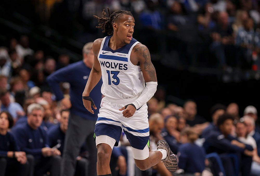 Minnesota Timberwolves guard Ayo Dosunmu (13) runs the court after scoring in the second half of an NBA basketball against the Dallas Mavericks game in Dallas.  - | Photo: AP/Gareth Patterson