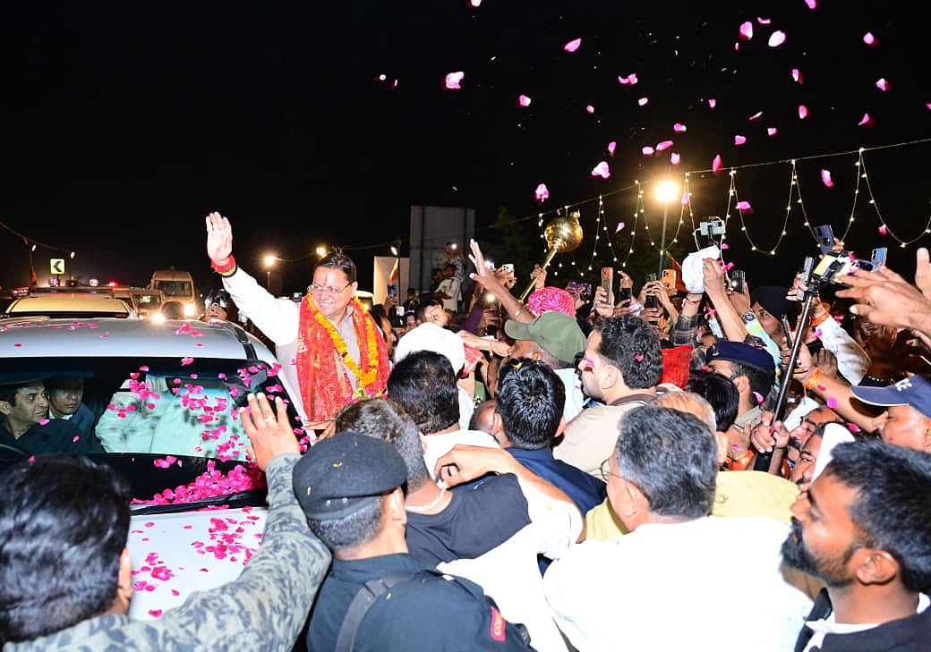 Uttarakhand CM Dhami receiving a warm welcome from BJP workers and locals - null