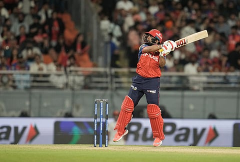 Punjab Kings' Prabhsimran Singh hits a six during the Indian Premier League cricket match between Gujarat Titans and Punjab Kings in New Chandigarh.