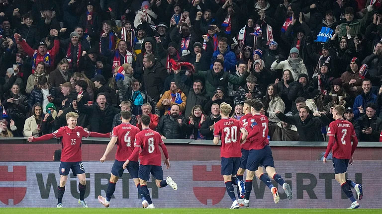 Czechia's Pavel Sulc, left, celebrates after scoring the opening goal during the World Cup qualifying playoff final soccer match between Czechia and Denmark in Prague, Tuesday, March 31, 2026. - (AP Photo/Petr David Josek)
