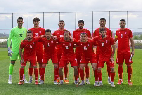 Iran's players pose for photographer prior a friendly soccer match between Iran and Costa Rica, in Antalya, southern Turkey.