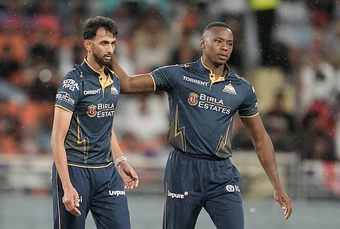 Gujarat Titans' Prasidh Krishna celebrates with Kagiso Rabada the wicket of Punjab Kings' Shashank Singh during the Indian Premier League cricket match between Gujarat Titans and Punjab Kings in New Chandigarh.