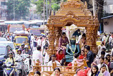 People take part in a procession, from Begum Bazar to Nampally Exhibition Grounds, on the 2625th birth anniversary of Lord Mahavir to celebrate ‘Mahavir Jayanti’, in Hyderabad, Telangana.