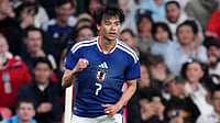 AP Photo/Kirsty Wigglesworth : Japan's Kaoru Mitoma celebrates after scoring his side's first goal during the International friendly soccer match between England and Japan in London, Tuesday, March 31, 2026 .
