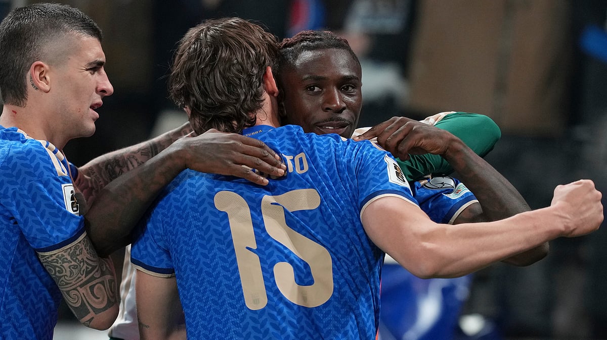 Teammates celebrate with Italy's Moise Kean, right, who scored his side's second goal during the World Cup qualifying play-off soccer match between Italy and Northern Ireland, in Bergamo, Italy, Thursday, March 26, 2026. - | Photo: AP/Antonio Calanni