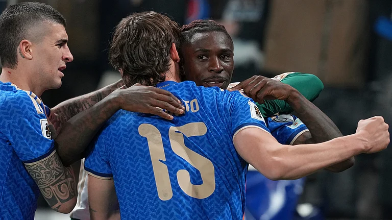 Teammates celebrate with Italy's Moise Kean, right, who scored his side's second goal during the World Cup qualifying play-off soccer match between Italy and Northern Ireland, in Bergamo, Italy, Thursday, March 26, 2026. - | Photo: AP/Antonio Calanni