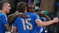 | Photo: AP/Antonio Calanni : Teammates celebrate with Italy's Moise Kean, right, who scored his side's second goal during the World Cup qualifying play-off soccer match between Italy and Northern Ireland, in Bergamo, Italy, Thursday, March 26, 2026.