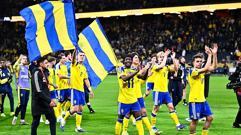 Sweden players and staff celebrate qualifying for the World Cup after a World Cup qualifying playoff final soccer match between Sweden and Poland in Stockholm, Tuesday, March 31, 2026. - (Pontus Lundahl/TT via AP)