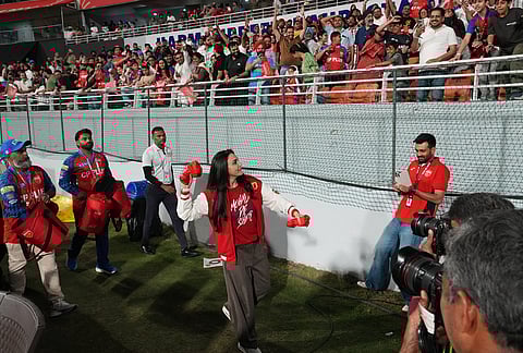 Punjab Kings' co-owner Preity Zinta throw jersey to the stands during the Indian Premier League cricket match between Gujarat Titans and Punjab Kings in New Chandigarh.
