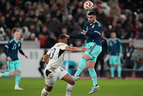 Deniz Undav of Germany heads the ball during an international friendly soccer match between Germany and Ghana in Stuttgart, Germany.