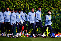 | Photo: Bradley Collyer/PA via AP : England's Phil Foden, Nico O'Reilly, and Harry Kane with team mates during a training session in London.